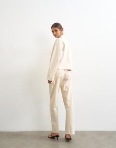 Model wearing Ember low rise relaxed straight leg jean with lace up detail in oat