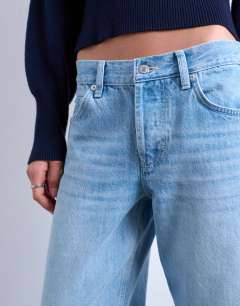 Model wearing Ember low rise straight jean in bleach