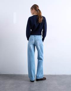 Model wearing Ember low rise straight jean in bleach