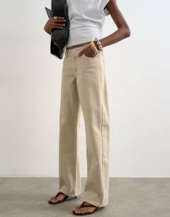 Model wearing Ember low rise straight jean in oat