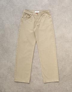 Model wearing Ember low rise straight leg jean in beige