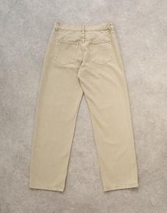Model wearing Ember low rise straight leg jean in beige