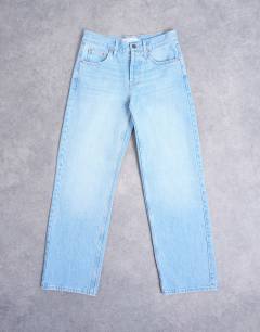 Model wearing Ember low rise straight leg jean in bleach