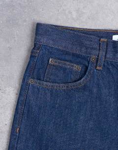 Model wearing Ember low rise straight leg jean in indigo rinse