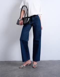 Model wearing Ember low rise straight leg jean in indigo rinse