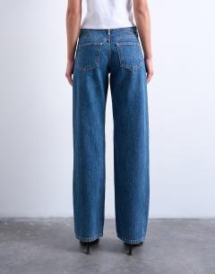 Model wearing Ember low rise straight leg jean in mid blue