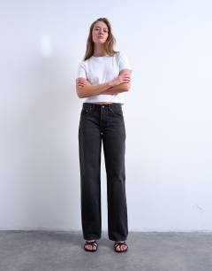 Model wearing Ember low rise straight leg jean in washed black