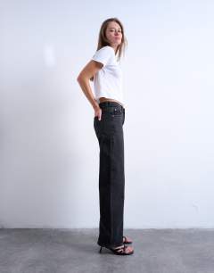 Model wearing Ember low rise straight leg jean in washed black