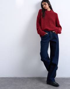 Model wearing Ember low rise straight leg jeans in indigo rinse