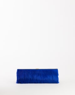 Model wearing Ember small hair on real leather envelope clutch bag in cobalt