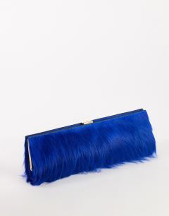 Model wearing Ember small hair on real leather envelope clutch bag in cobalt