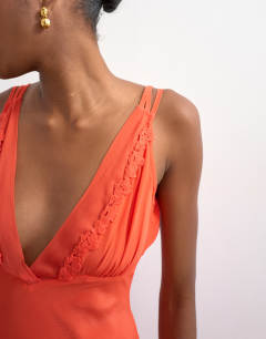 Model wearing Embroidered maxi occasion dress in orange