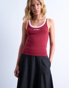 Model wearing Embroidered Roma contrast rib vest in burgundy