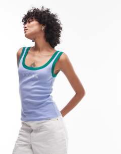 Model wearing Embroidered Tulum contrast rib vest in purple