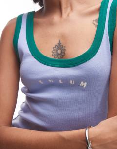 Model wearing Embroidered Tulum contrast rib vest in purple