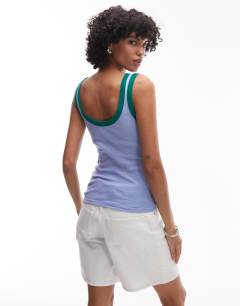 Model wearing Embroidered Tulum contrast rib vest in purple