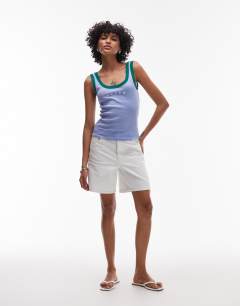 Model wearing Embroidered Tulum contrast rib vest in purple