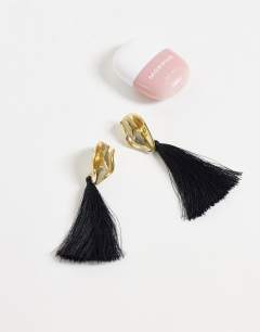 Model wearing Emil tassel statement earring in black