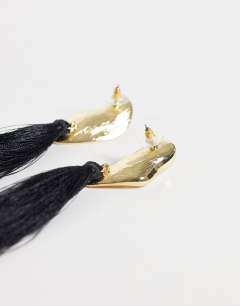 Model wearing Emil tassel statement earring in black