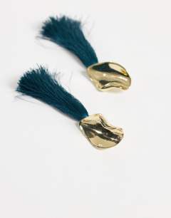 Model wearing Emil tassel statement earring in teal