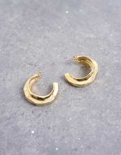 Model wearing Emily chunky hoop earring in gold