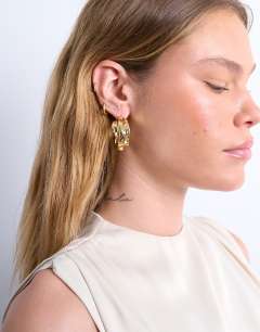 Model wearing Emily chunky hoop earring in gold