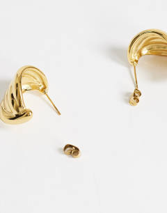 Model wearing Emry waterproof stainless steel stud earring in gold