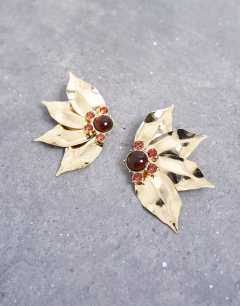 Model wearing Enzo floral statement stud earring in gold