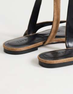 Model wearing Erika real suede flat sandal in taupe