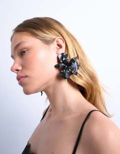 Model wearing Erika statement floral stud earrings in black