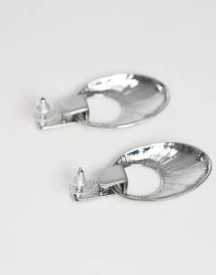 Model wearing Esme door-knocker earrings in silver brushed