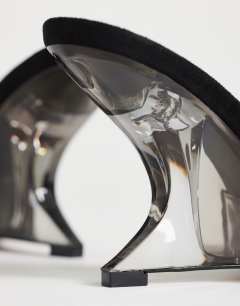 Model wearing Esme mule with clear wedge heel in black