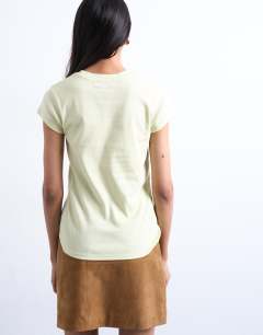 Model wearing Everyday tee in light green