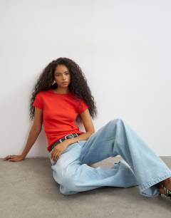 Model wearing Everyday tee in red