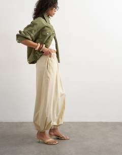 Model wearing Extreme poplin  pull on balloon trouser in yellow