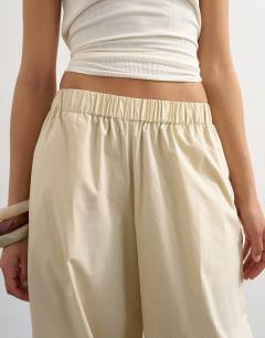 Model wearing Extreme poplin  pull on balloon trouser in yellow