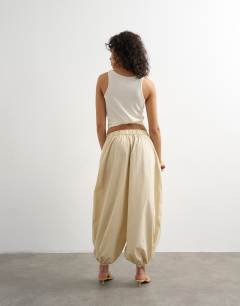 Model wearing Extreme poplin  pull on balloon trouser in yellow