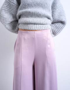 Model wearing Extreme wide leg satin trouser in pink
