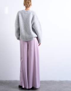 Model wearing Extreme wide leg satin trouser in pink