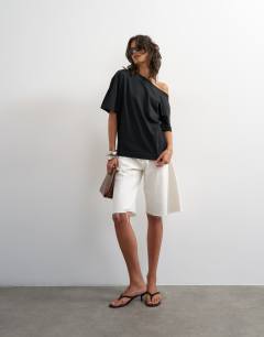 Model wearing Fallen shoulder t-shirt in black