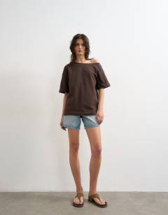 Model wearing Fallen shoulder t-shirt in dark chocolate