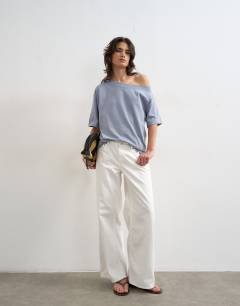 Model wearing Fallen shoulder t-shirt in dusty blue