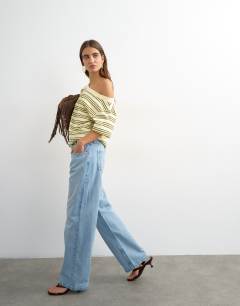 Model wearing Fallen shoulder t-shirt in yellow stripe