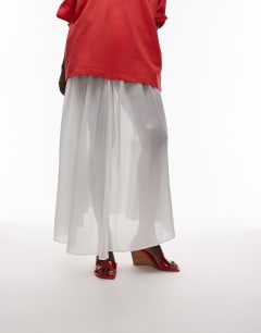 Model wearing Farah high wedge heeled mule in red