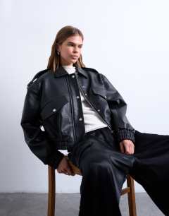Model wearing Faux bubble leather 80s bomber jacket in black