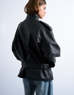 Model wearing Faux bubble leather short belted funnel bomber jacket in black