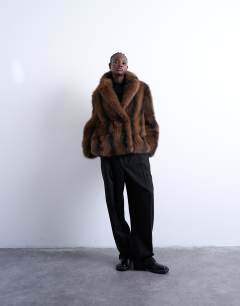 Model wearing Faux fur boxy blazer coat in brown stripe