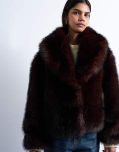 Model wearing Faux fur boxy shawl coat in dark burgundy