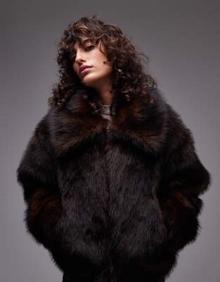 Topshop faux fur cow print funnel neck bomber jacket in cream