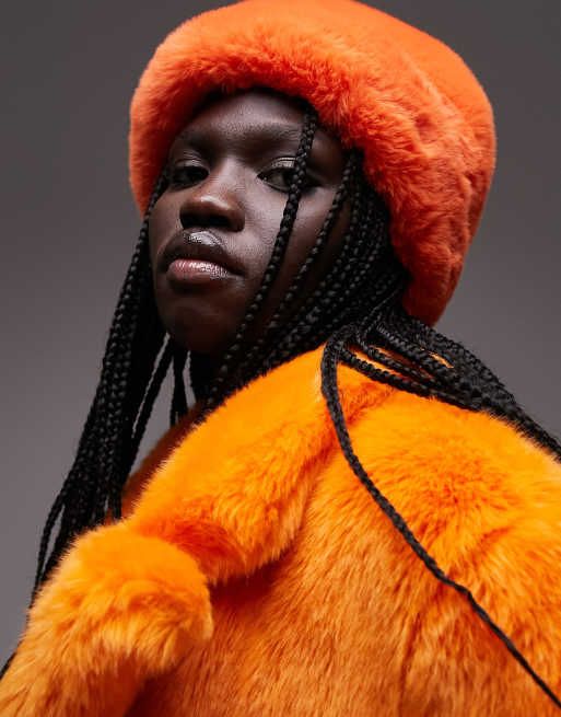 Topshop faux fur hat in orange ASOS